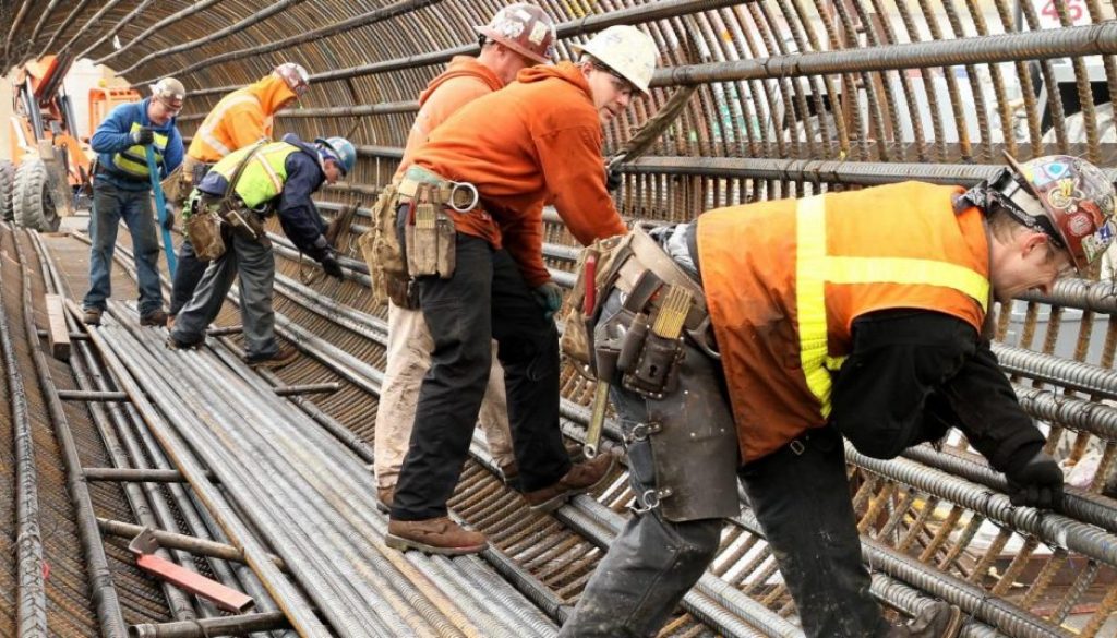 photo of workers in hard hats on the job